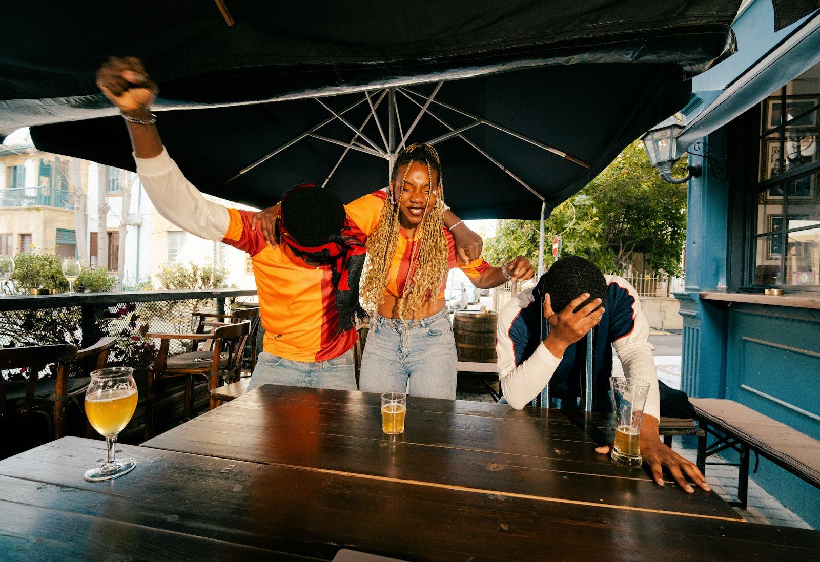 Sports fans gathered together at a bar during a live match